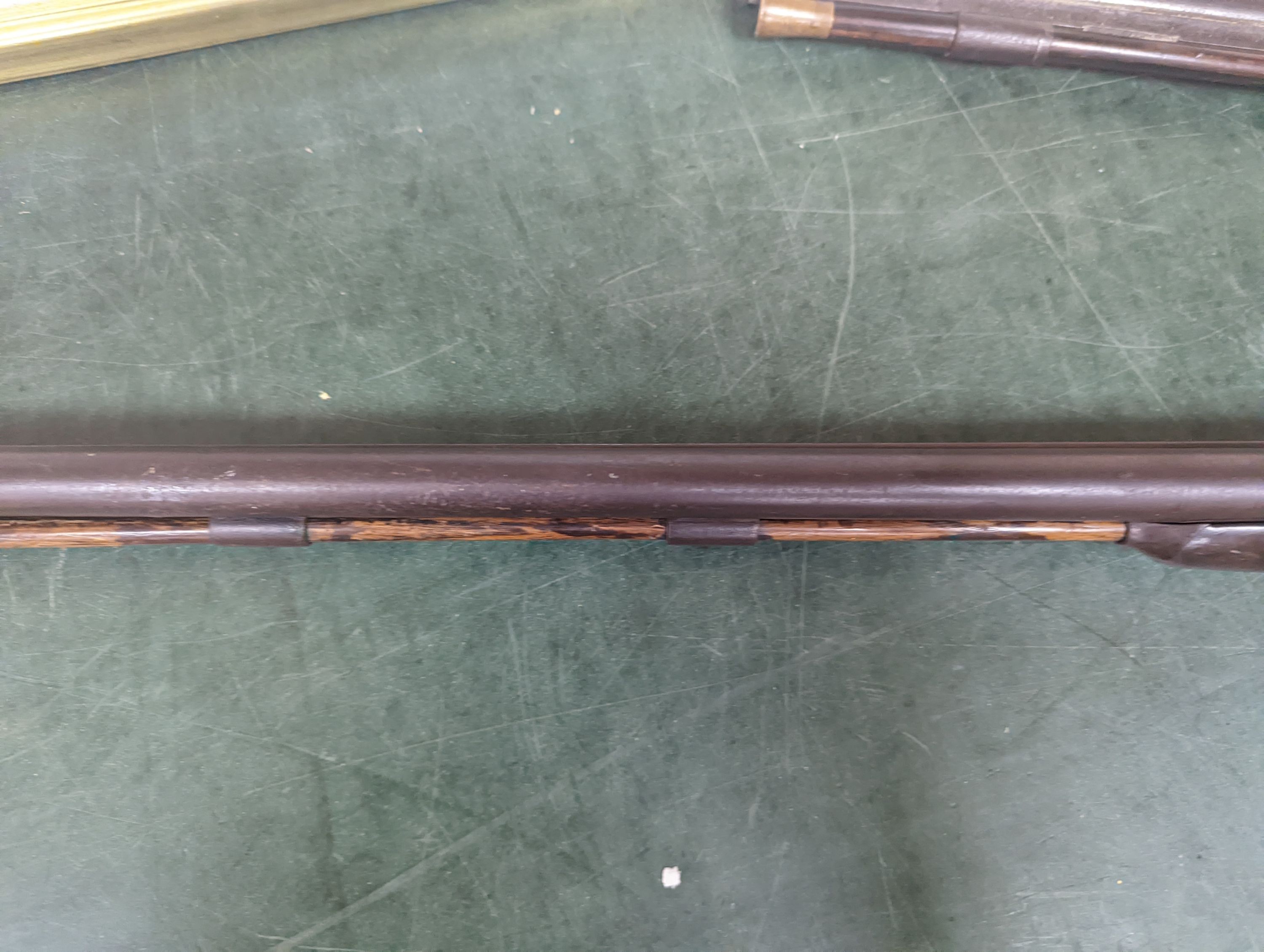 Two 19th century percussion muskets, 103cm. max., one double-barrelled